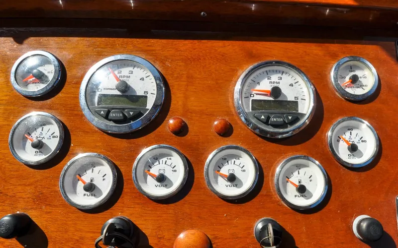 Slide: The Image of 1958 Bunker and Ellis 42 | Aleria Dashboard of a 1958 Bunker and Ellis 42 boat with various gauges and controls. - 6307419