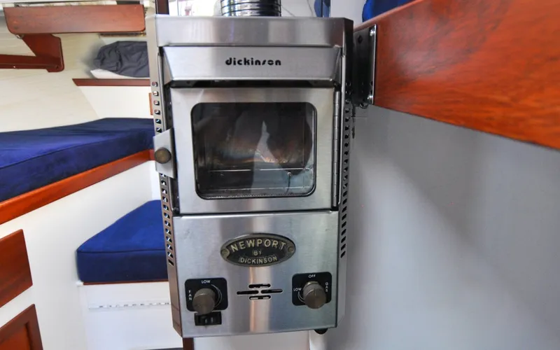 Slide: The Image of 1958 Bunker and Ellis 42 | Aleria Stainless steel Dickinson heater inside a 1958 Bunker and Ellis 42 boat cabin. - 6307507