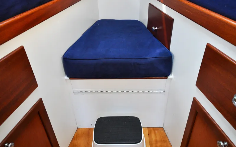 Slide: The Image of 1958 Bunker and Ellis 42 | Aleria Interior cabin of a 1958 Bunker and Ellis 42 boat with blue cushion. - 6307510