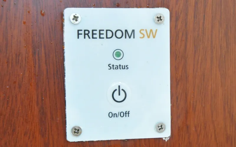 Slide: The Image of 1958 Bunker and Ellis 42 | Aleria Switch panel labeled "FREEDOM SW" on a 1958 Bunker and Ellis 42 boat. - 6307534