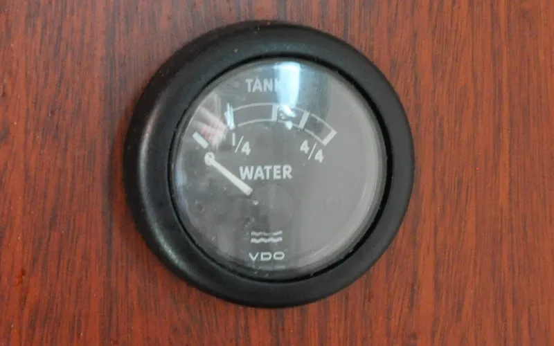 Slide: The Image of 1958 Bunker and Ellis 42 | Aleria Water tank gauge on 1958 Bunker and Ellis 42 boat dashboard. - 6307538