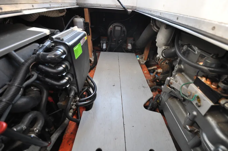 Slide: The Image of 1958 Bunker and Ellis 42 | Aleria Engine room of a 1958 Bunker and Ellis 42 boat, showcasing mechanical components. - 6307455
