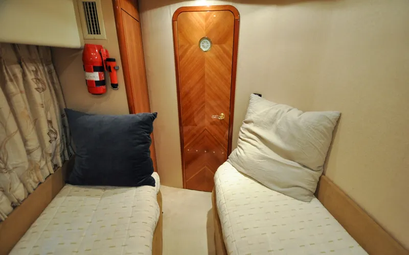 Slide: The Image of 1996 Azimut 54 | Calmati 1996 Azimut Cinquantaquattro yacht cabin with twin beds and wooden door. - 6308941