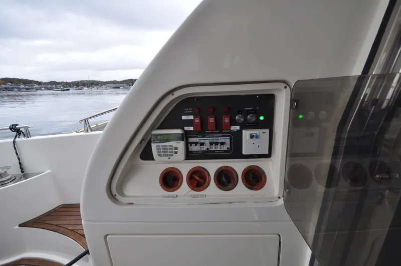 Slide: The Image of 1996 Azimut 54 | Calmati Control panel of a 1996 Azimut Cinquantaquattro yacht with switches and indicators. - 6308566