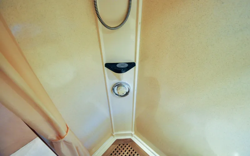 Slide: The Image of 1996 Azimut 54 | Calmati Shower area in 1996 Azimut Cinquantaquattro yacht with beige walls and curtain. - 6308960