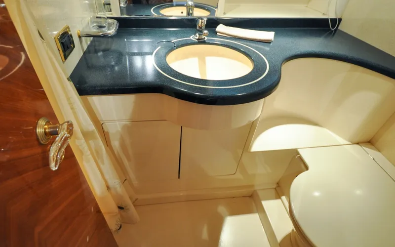 Slide: The Image of 1996 Azimut 54 | Calmati Luxurious bathroom interior of 1996 Azimut Cinquantaquattro yacht with elegant sink and countertop. - 6308971