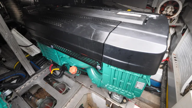 Slide: The Image of 1996 Azimut 54 | Calmati Engine compartment of a 1996 Azimut 54 yacht, featuring a modern marine engine. - 6309005