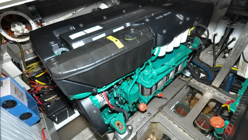 Slide: The Image of 1996 Azimut 54 | Calmati Engine room of a 1996 Azimut 54 yacht with Volvo Penta D12-800 engine. - 6309009