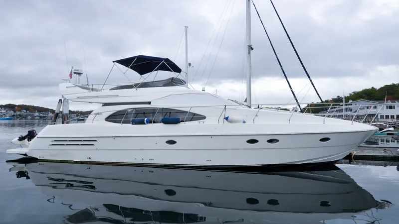 Slide: The Image of 1996 Azimut 54 | Calmati Luxury 1996 Azimut Cinquantaquattro yacht docked in scenic marina setting. - 6308844