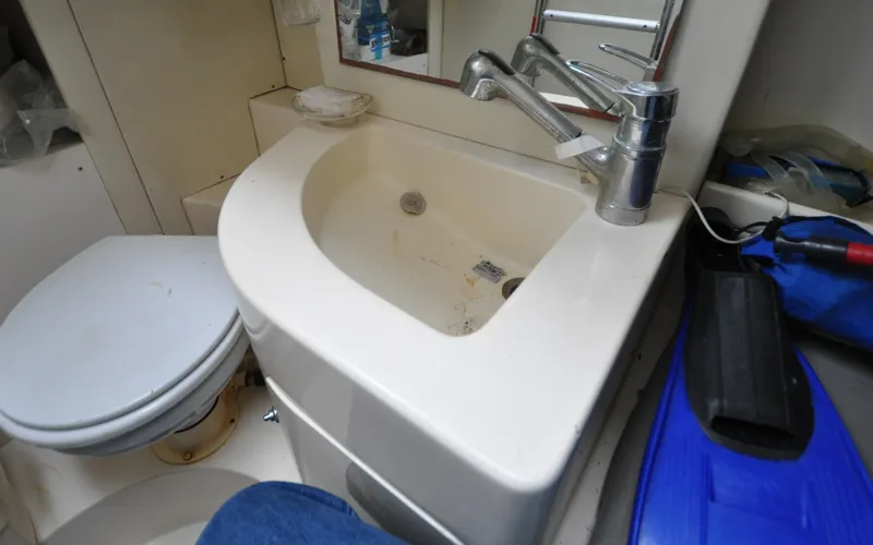 Slide: The Image of 1996 Azimut 54 | Calmati Bathroom sink and toilet in a 1996 Azimut Cinquantaquattro yacht. - 6308836