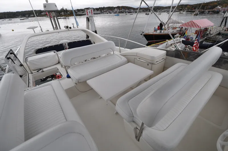 Slide: The Image of 1996 Azimut 54 | Calmati Luxurious 1996 Azimut Cinquantaquattro yacht with spacious white seating and modern dashboard. - 6308797