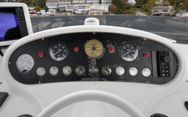 Slide: The Image of 1996 Azimut 54 | Calmati 1996 Azimut Cinquantaquattro yacht dashboard with gauges and navigation equipment. - 6308895