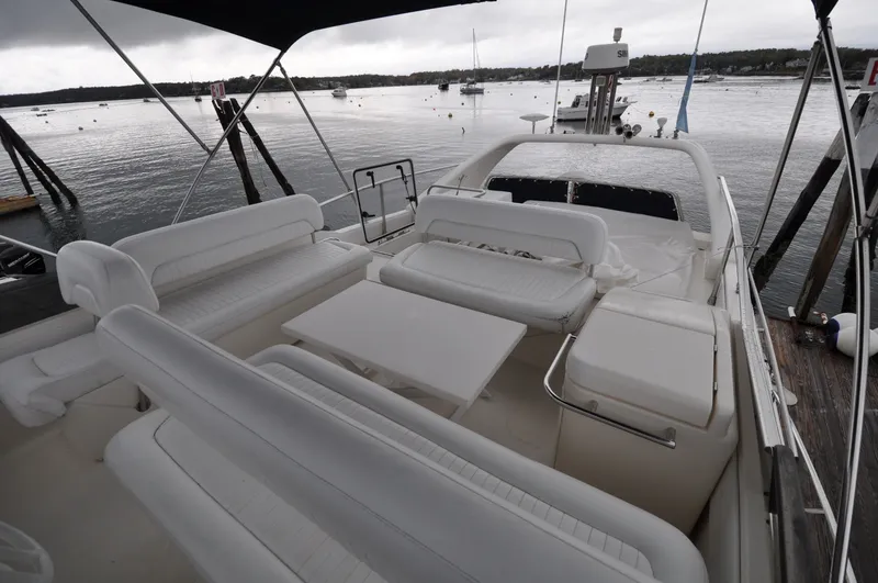 Slide: The Image of 1996 Azimut 54 | Calmati Luxurious 1996 Azimut Cinquantaquattro yacht with spacious white seating on deck. - 6308804