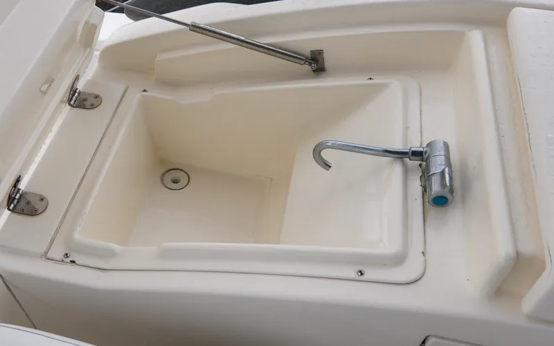 Slide: The Image of 1996 Azimut 54 | Calmati 1996 Azimut Cinquantaquattro yacht sink with faucet and storage compartment. - 6308902