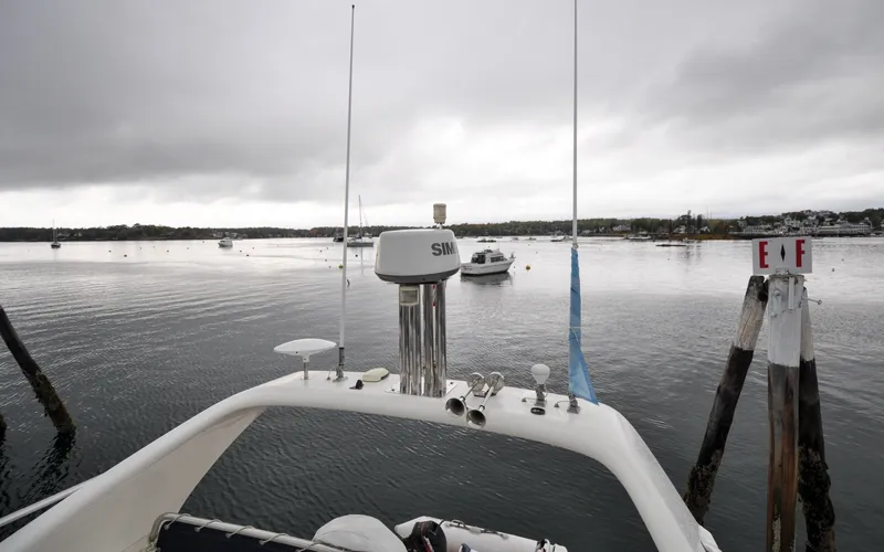 Slide: The Image of 1996 Azimut 54 | Calmati 1996 Azimut Cinquantaquattro yacht on calm waters under cloudy skies. - 6308912
