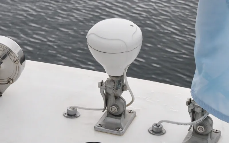 Slide: The Image of 1996 Azimut 54 | Calmati Close-up of a 1996 Azimut Cinquantaquattro boat's deck equipment by the water. - 6308908