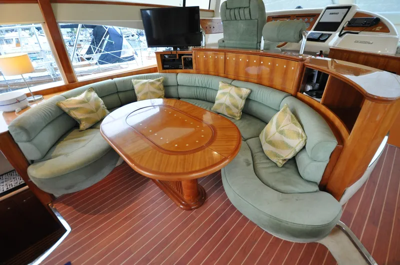 Slide: The Image of 1996 Azimut 54 | Calmati Luxurious interior of 1996 Azimut Cinquantaquattro yacht with elegant seating and wooden table. - 6308614