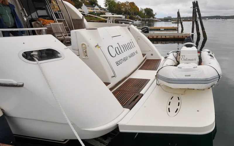 Slide: The Image of 1996 Azimut 54 | Calmati Azimut Cinquantaquattro 1996 yacht docked with inflatable boat, Boothbay Harbor. - 6308847