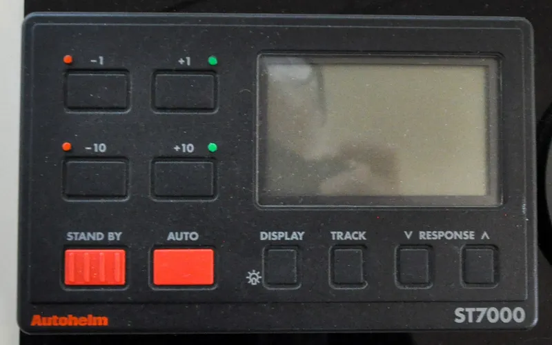 Slide: The Image of 1996 Azimut 54 | Calmati Autopilot control panel on 1996 Azimut Cinquantaquattro yacht, featuring buttons and display. - 6308919