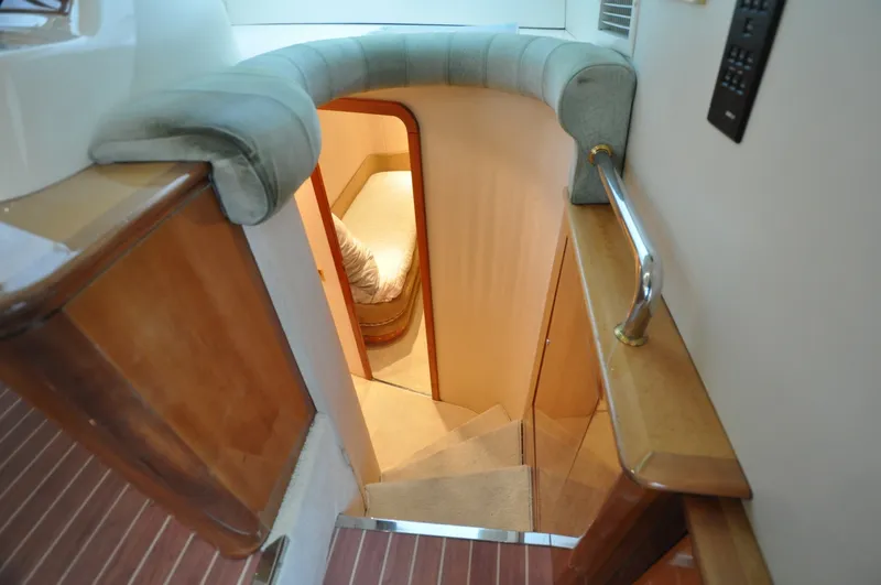 Slide: The Image of 1996 Azimut 54 | Calmati Interior staircase of 1996 Azimut Cinquantaquattro yacht, leading to a cozy cabin. - 6308671