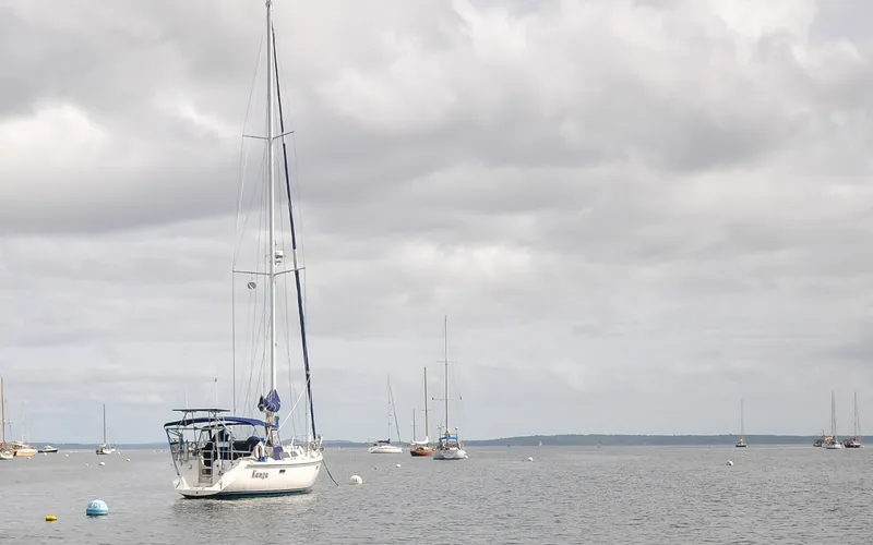The Image of 1993 Catalina 42 | Kanga Sailboat Catalina 42 (1993) anchored on a cloudy day in a calm bay. - 6318813