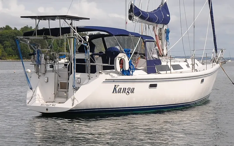 Slide: The Image of 1993 Catalina 42 | Kanga Sailboat "Kanga," a 1993 Catalina 42, anchored in calm waters. - 6318847