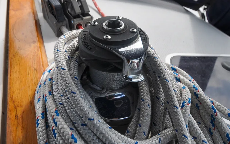 Slide: The Image of 1993 Catalina 42 | Kanga Winch with coiled ropes on a 1993 Catalina 42 sailboat deck. - 6318888