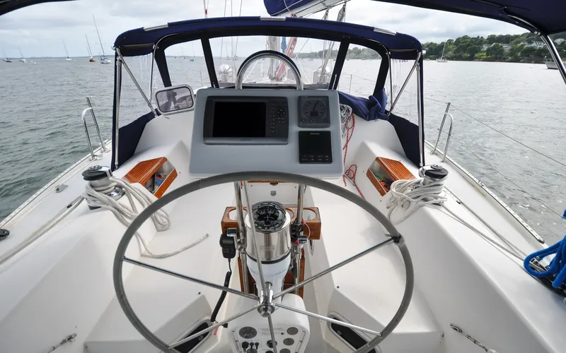 Slide: The Image of 1993 Catalina 42 | Kanga Cockpit view of a 1993 Catalina 42 sailboat with steering wheel and navigation instruments. - 6318875