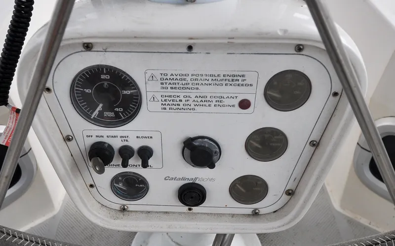 Slide: The Image of 1993 Catalina 42 | Kanga Control panel of a 1993 Catalina 42 yacht with gauges and switches. - 6318880