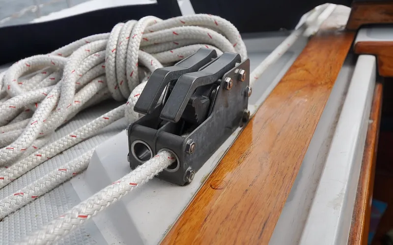 Slide: The Image of 1993 Catalina 42 | Kanga Close-up of a Catalina 42 sailboat's rope cleat and deck, 1993 model. - 6318889