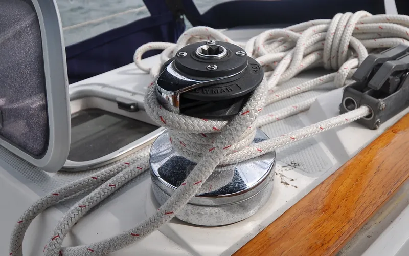 Slide: The Image of 1993 Catalina 42 | Kanga Winch and rope on a 1993 Catalina 42 sailboat deck. - 6318890
