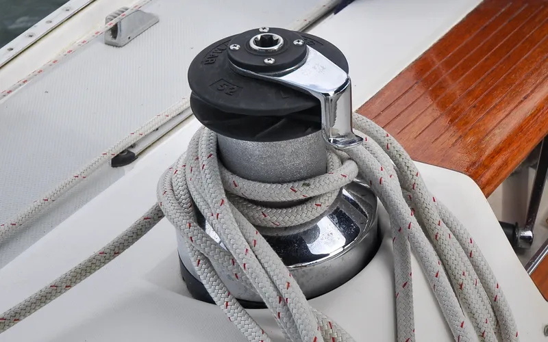 Slide: The Image of 1993 Catalina 42 | Kanga Winch with rope on 1993 Catalina 42 sailboat deck. - 6318885