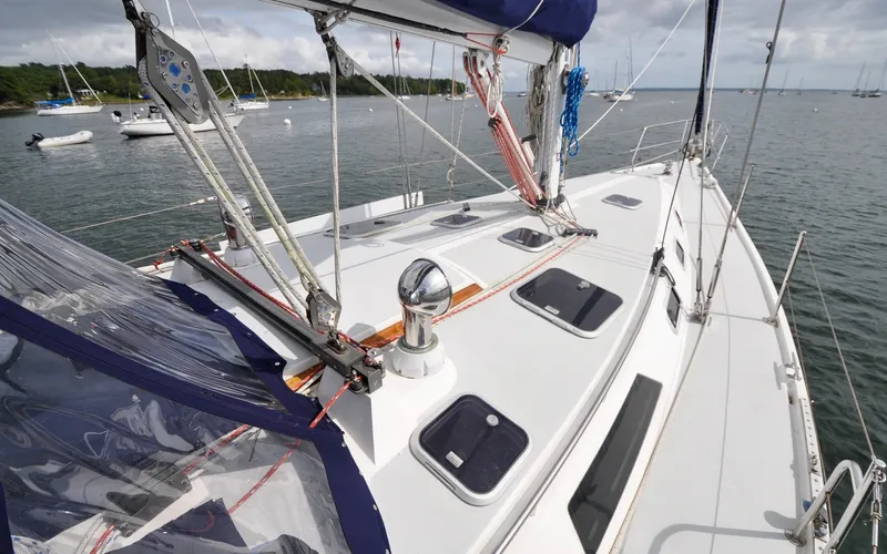 Slide: The Image of 1993 Catalina 42 | Kanga Sailing yacht Catalina 42, 1993 model, docked in a serene harbor. - 6318854