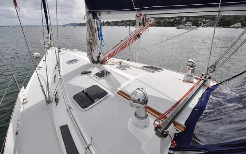 Slide: The Image of 1993 Catalina 42 | Kanga Deck view of a 1993 Catalina 42 sailboat on calm waters. - 6318855