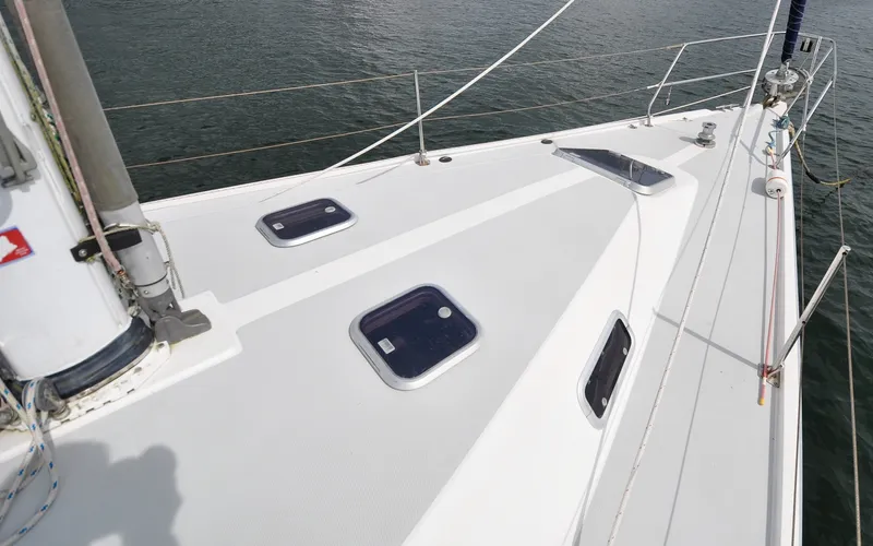 Slide: The Image of 1993 Catalina 42 | Kanga Deck view of a 1993 Catalina 42 sailboat, featuring hatches and rigging. - 6318856