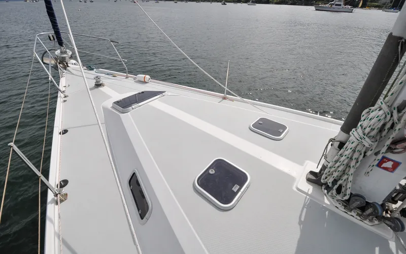Slide: The Image of 1993 Catalina 42 | Kanga Deck view of a 1993 Catalina 42 sailboat on calm waters. - 6318857