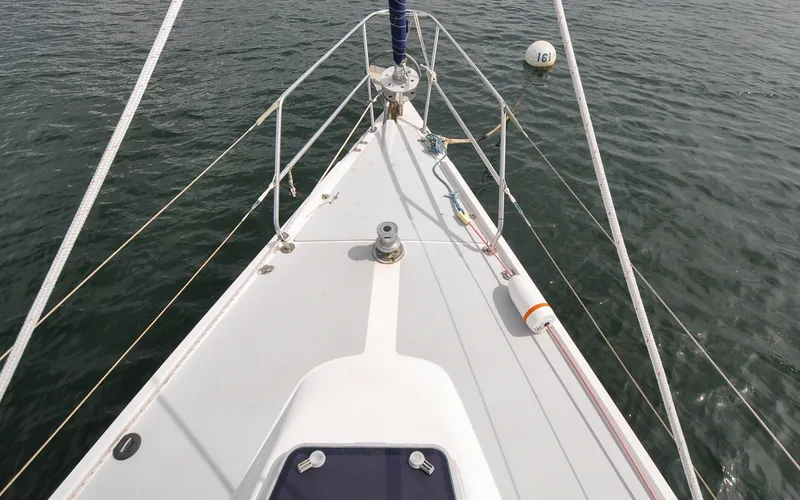 Slide: The Image of 1993 Catalina 42 | Kanga Bow view of a 1993 Catalina 42 sailboat on calm water. - 6318860