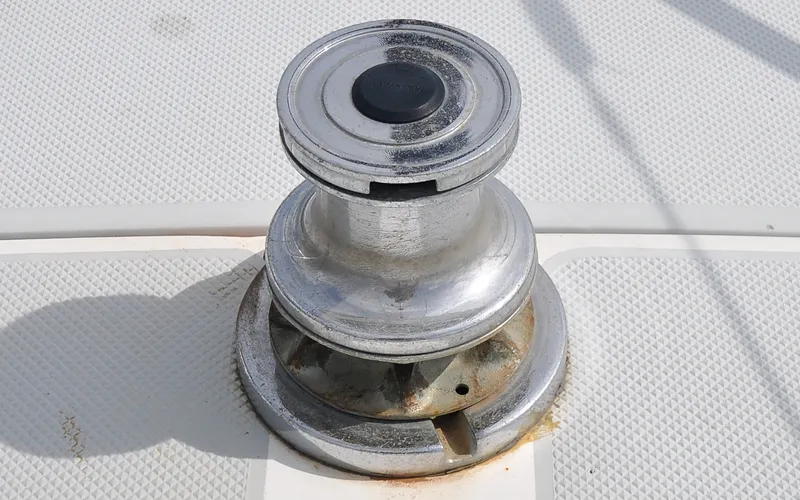 Slide: The Image of 1993 Catalina 42 | Kanga Winch on 1993 Catalina 42 sailboat deck, close-up view. - 6318861