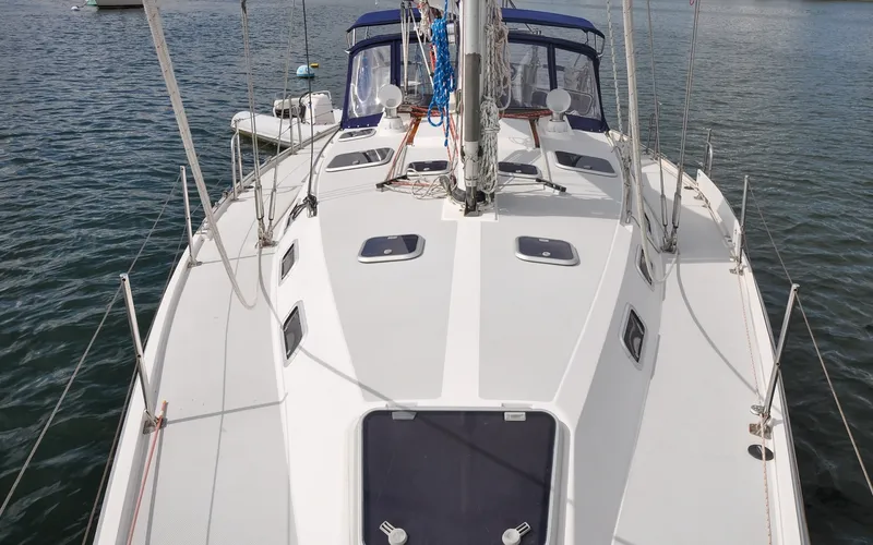 Slide: The Image of 1993 Catalina 42 | Kanga Sailboat deck view of 1993 Catalina 42 model on calm water. - 6318864