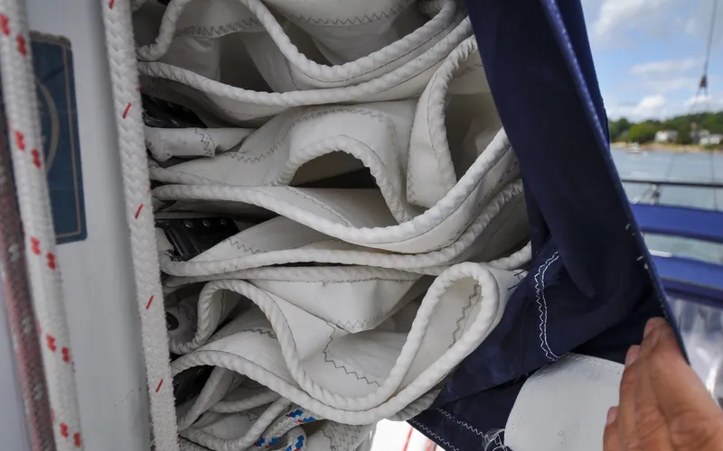 Slide: The Image of 1993 Catalina 42 | Kanga Folded sail on a 1993 Catalina 42 yacht, neatly stored in a sail cover. - 6318865