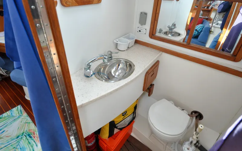 Slide: The Image of 1993 Catalina 42 | Kanga Bathroom interior of 1993 Catalina 42 sailboat with sink and toilet. - 6318941