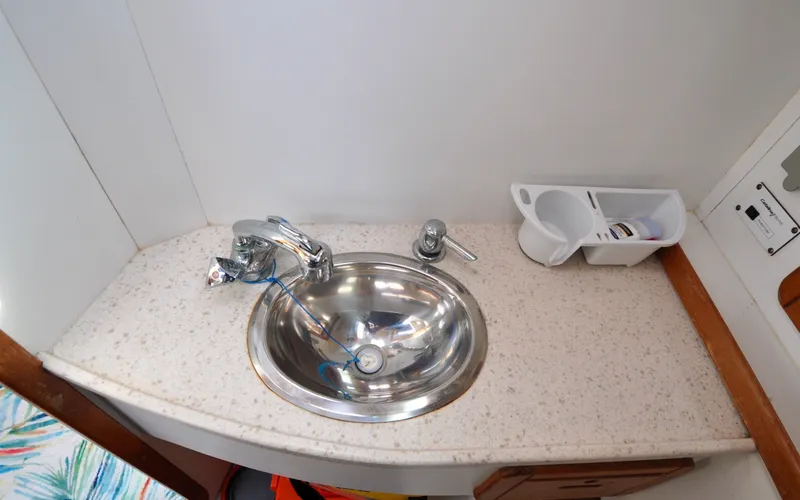Slide: The Image of 1993 Catalina 42 | Kanga Stainless steel sink in 1993 Catalina 42 yacht bathroom. - 6318946
