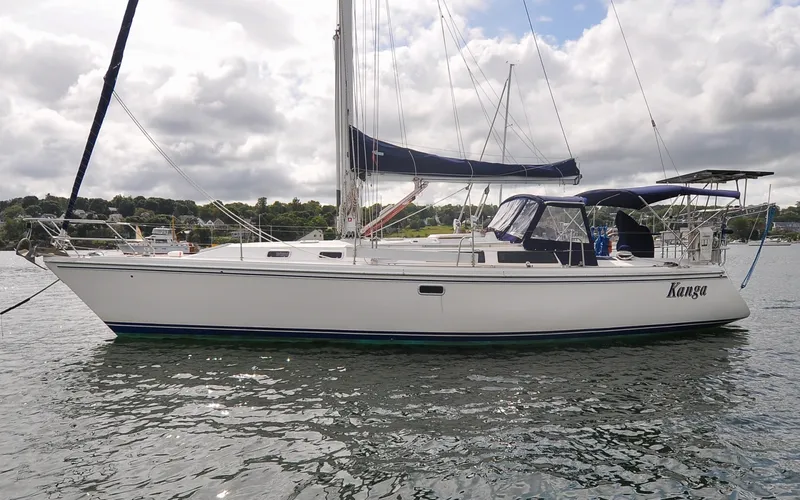 Slide: The Image of 1993 Catalina 42 | Kanga Sailboat "Kanga," a 1993 Catalina 42, anchored on a calm waterway. - 6318834
