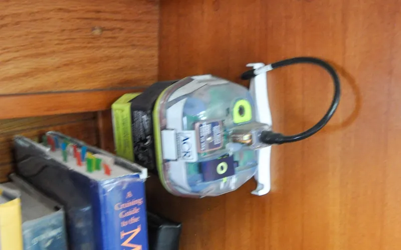 Slide: The Image of 1993 Catalina 42 | Kanga Electronic device mounted on a wooden wall inside a 1993 Catalina 42 boat. - 6318910