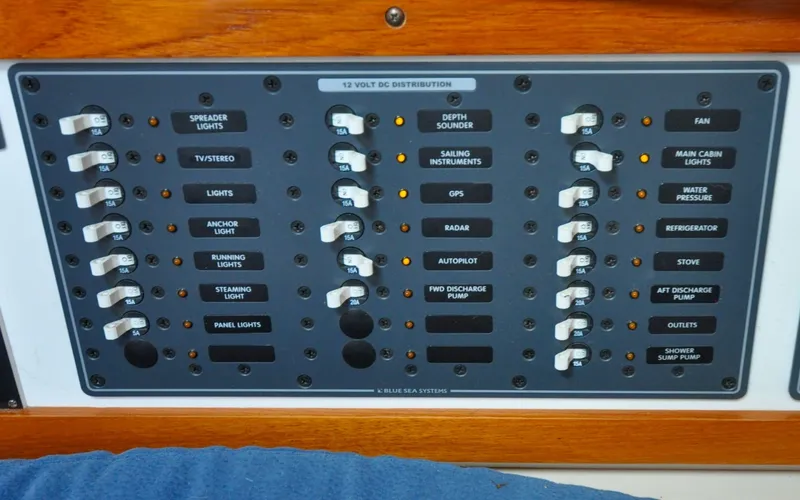 Slide: The Image of 1993 Catalina 42 | Kanga Control panel of a 1993 Catalina 42 sailboat with labeled switches and indicators. - 6318908