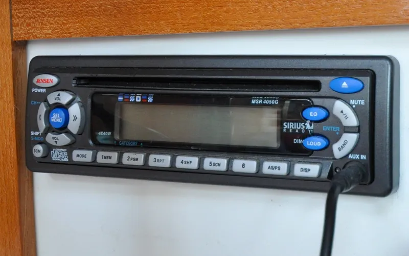 Slide: The Image of 1993 Catalina 42 | Kanga Jensen stereo system in a 1993 Catalina 42 yacht, featuring Sirius and CD capabilities. - 6318916