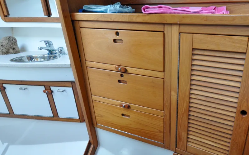 Slide: The Image of 1993 Catalina 42 | Kanga Wooden cabinetry and sink in 1993 Catalina 42 yacht interior. - 6318899