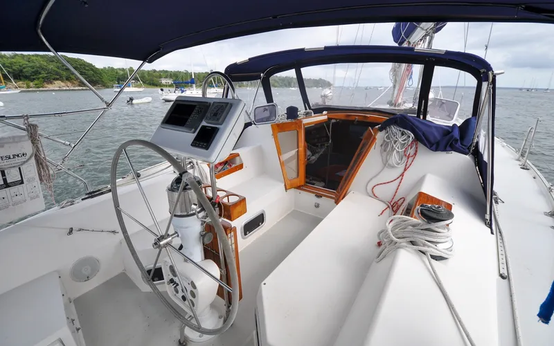 Slide: The Image of 1993 Catalina 42 | Kanga Cockpit of 1993 Catalina 42 sailboat with steering wheel and navigation instruments. - 6318881