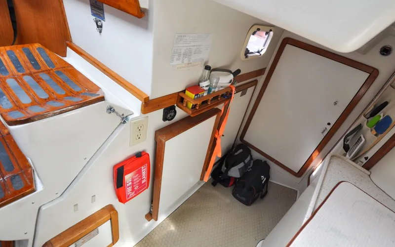 Slide: The Image of 1993 Catalina 42 | Kangaanga Interior of a 1993 Catalina 42 sailboat with safety equipment and storage. - 6318937