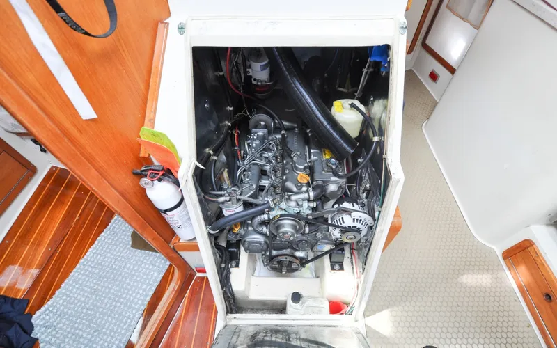 Slide: The Image of 1993 Catalina 42 | Kanga Engine compartment of a 1993 Catalina 42 sailboat, showcasing detailed mechanical components. - 6318947